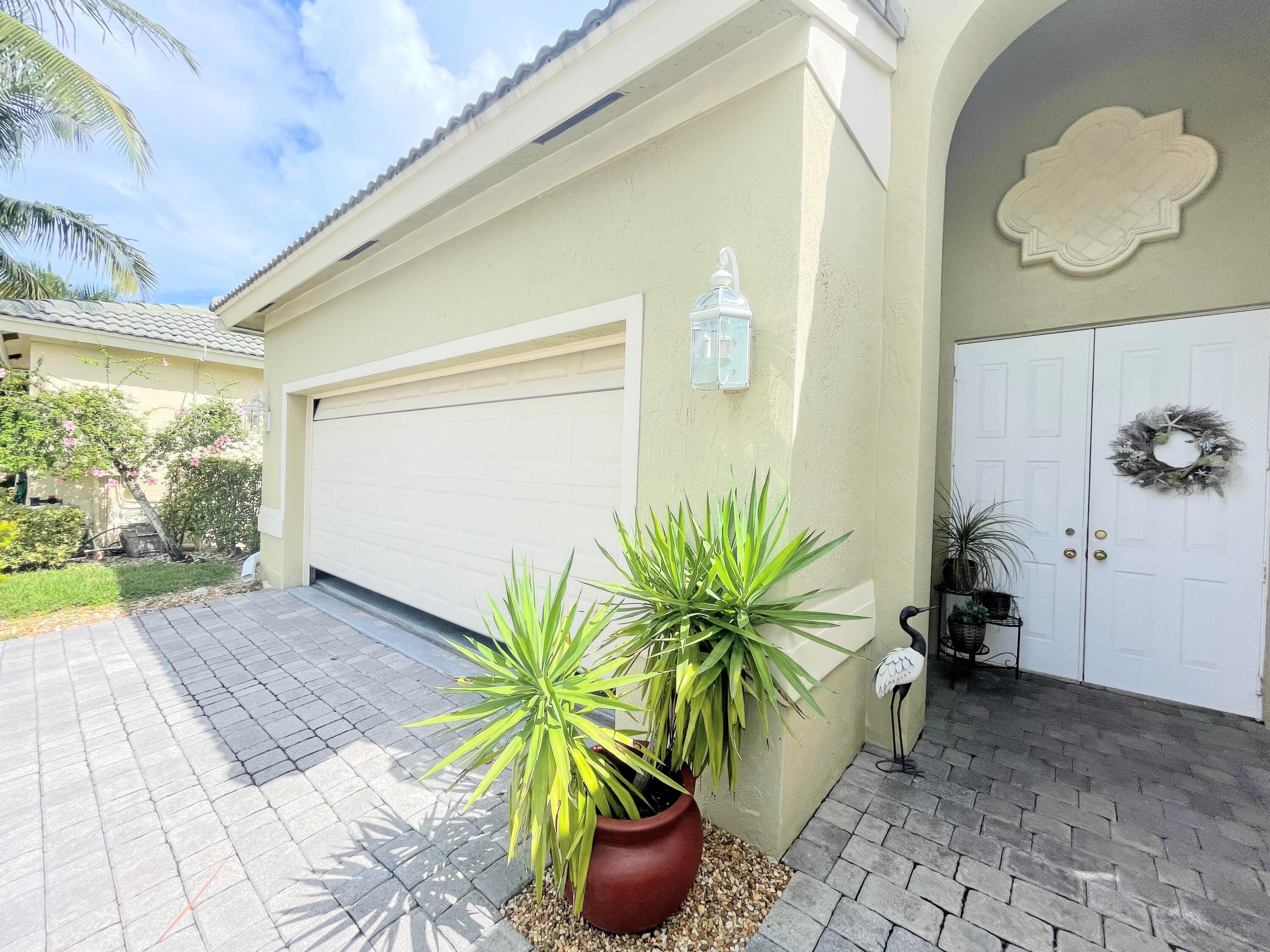 7060 Northwest Turtle Walk Boca Raton, FL 33487 - Photo 3 of 51 FRONT EXTERIOR