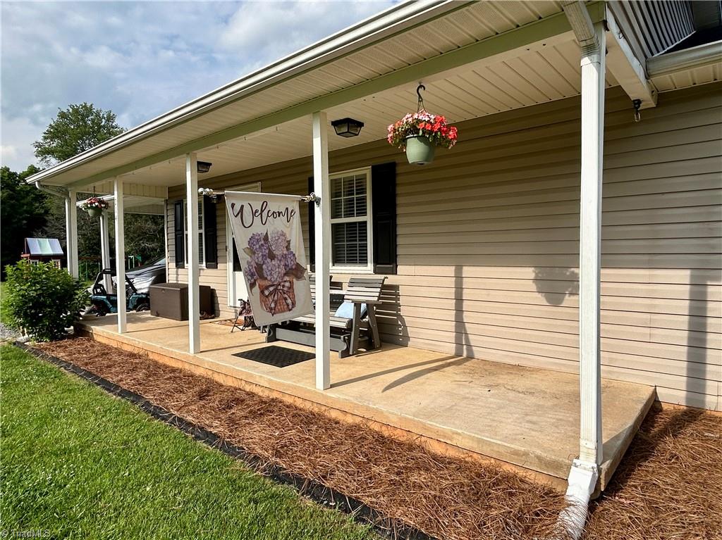 214 Fork Bixby Road Advance, NC 27006 - Photo 23 of 40 Beautiful covered front porch