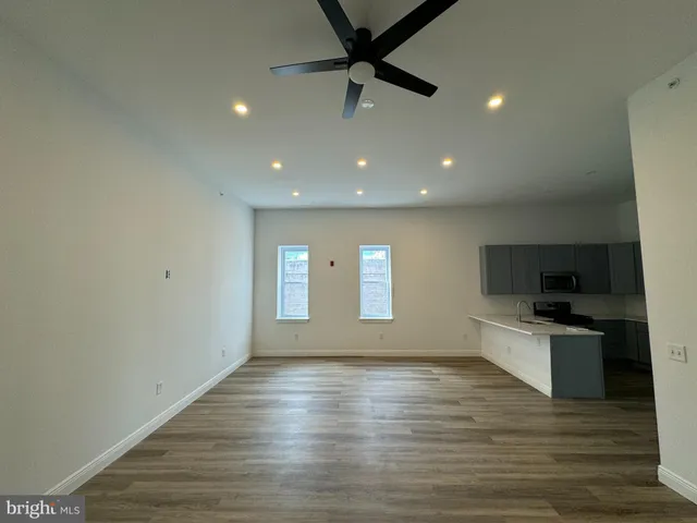 a view of a kitchen with a sink and a microwave