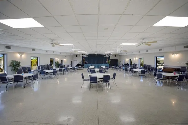 a living room with lots of furniture and a clock
