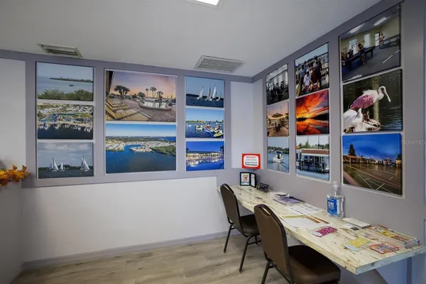 a workspace with furniture and painting on the wall