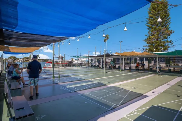 a view of a swimming pool with outdoor seating