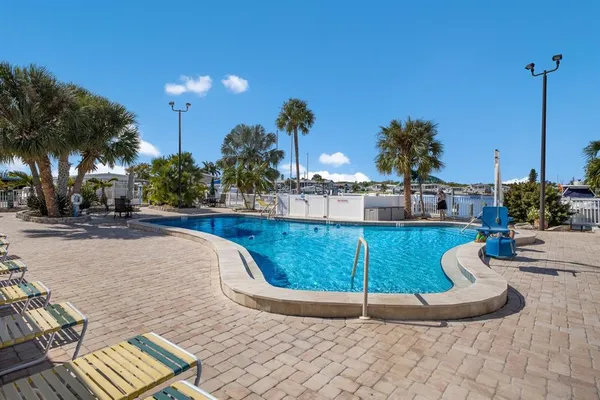 a view of a swimming pool with a sitting area