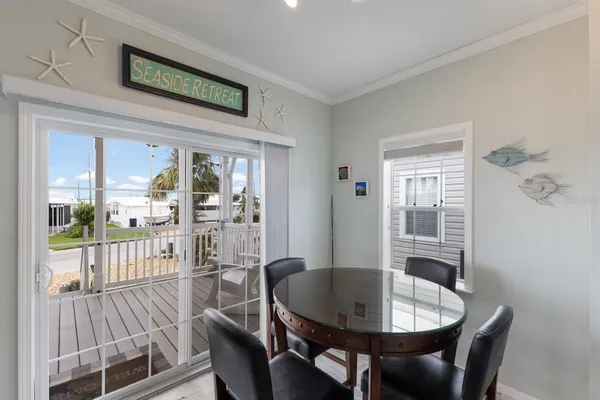a view of a dining room with furniture window and outside view