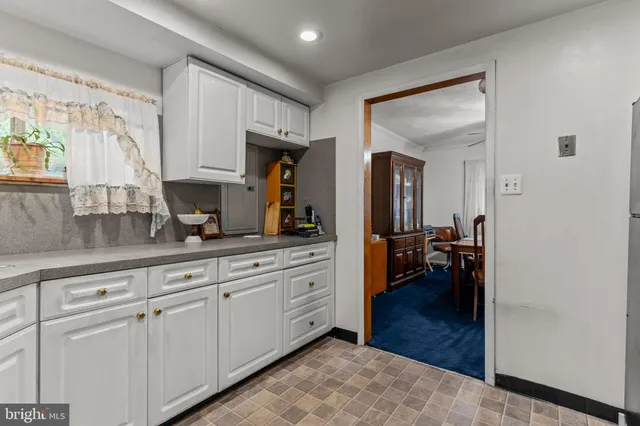 a spacious en suite bathroom with a double vanity sink and a mirror