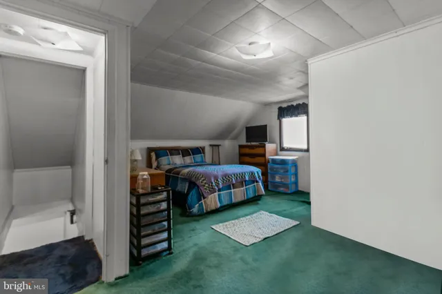 a bedroom with a bed and a cabinets