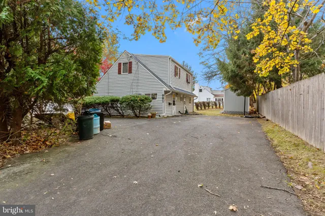 a view of a house with a yard and garage