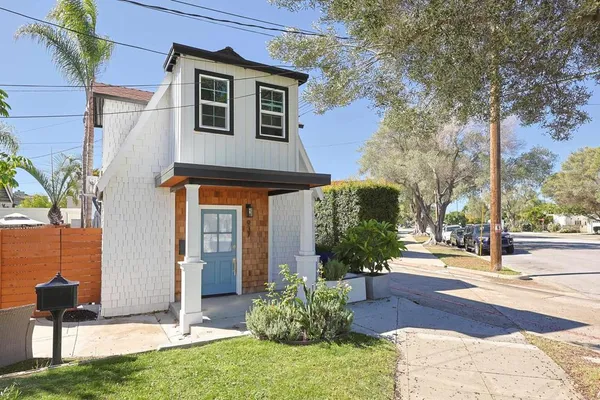 a front view of a house with garden