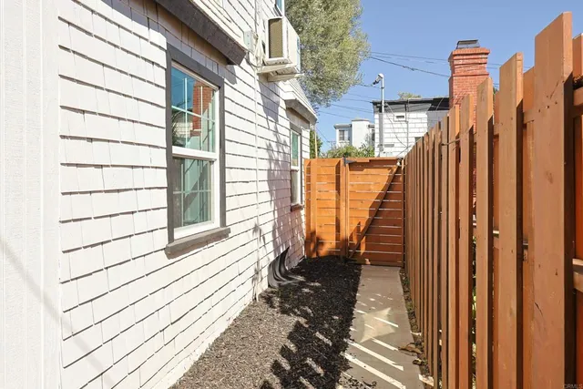 a view of a balcony with wooden floor and stairs