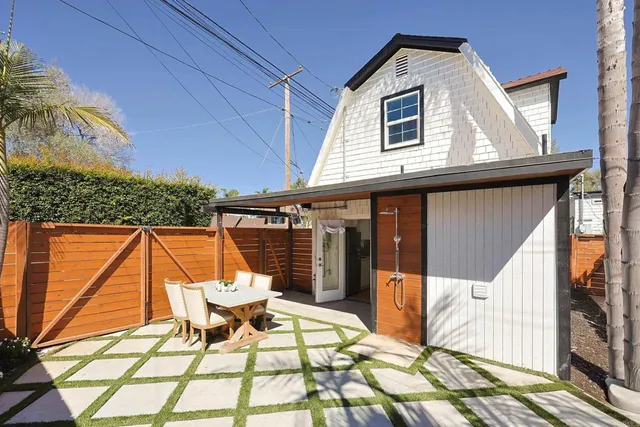a patio with a table and chairs