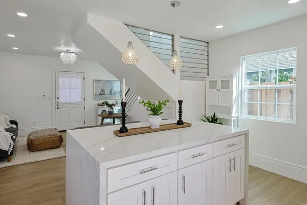 a kitchen with a sink and cabinets