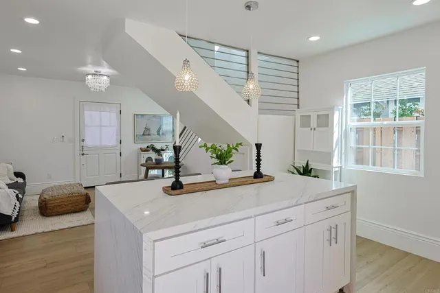 a kitchen with a sink and cabinets