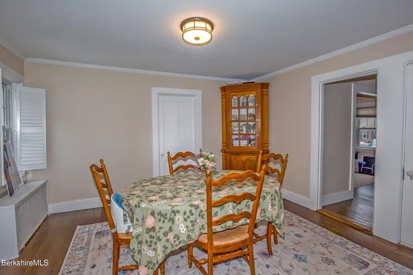 a view of a dining room with furniture and window