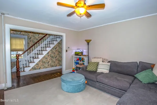 a living room with fireplace furniture and a flat screen tv