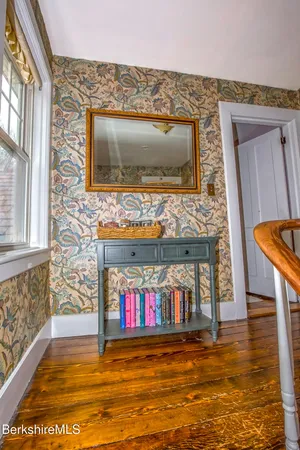 view of stairs with wooden floor