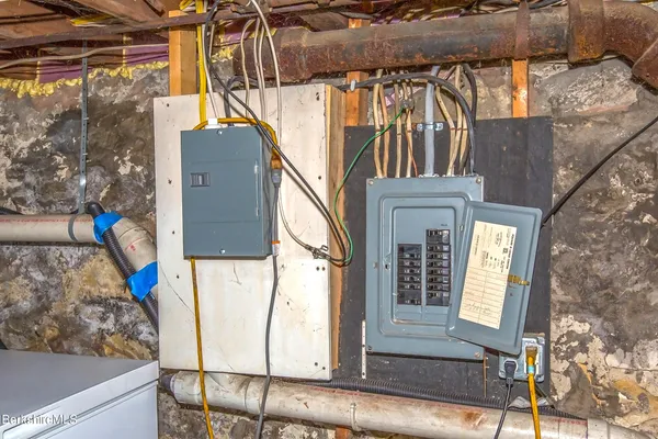 a picture of a bench in front of a wall