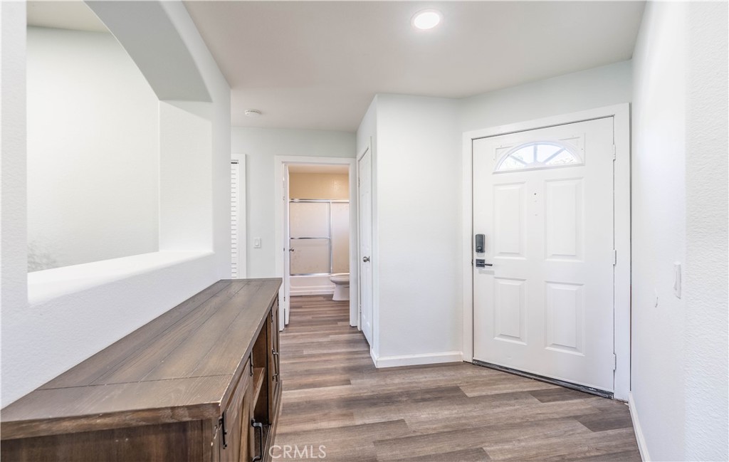 102 Vía Contento Rancho Santa Margarita, CA 92688 - Photo 11 of 40 a view of a hallway with wooden floor