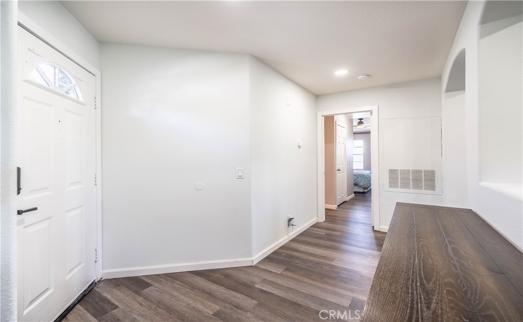 102 Vía Contento Rancho Santa Margarita, CA 92688 - Photo 12 of 40 a view of a hallway with wooden floor