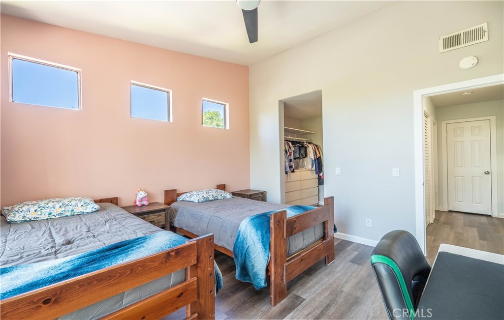 102 Vía Contento Rancho Santa Margarita, CA 92688 - Photo 16 of 40 a bedroom with two beds and painted walls