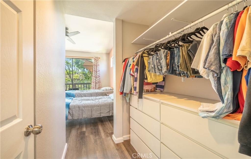 102 Vía Contento Rancho Santa Margarita, CA 92688 - Photo 18 of 40 a view of walk in closet with clothes and shoes