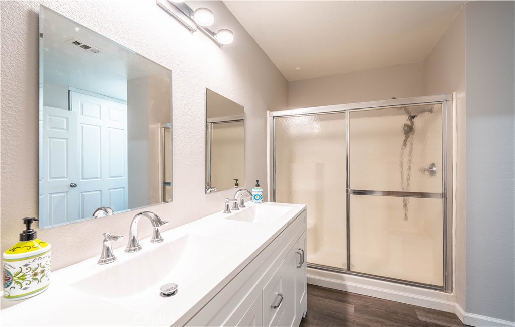 102 Vía Contento Rancho Santa Margarita, CA 92688 - Photo 20 of 40 a bathroom with a sink and a mirror