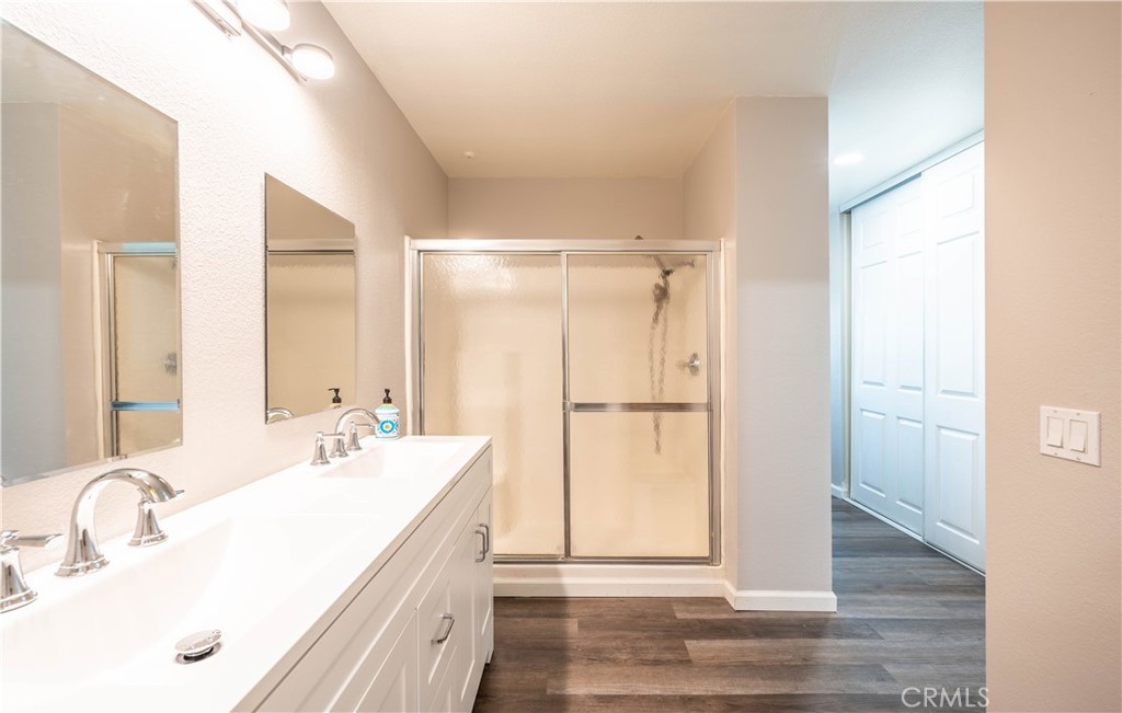 102 Vía Contento Rancho Santa Margarita, CA 92688 - Photo 21 of 40 a bathroom with a double vanity sink mirror and double