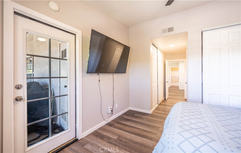 102 Vía Contento Rancho Santa Margarita, CA 92688 - Photo 24 of 40 a bedroom with a bed and a flat screen tv