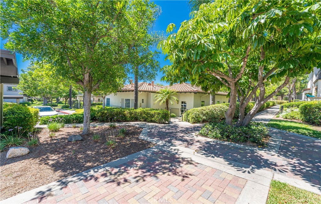 102 Vía Contento Rancho Santa Margarita, CA 92688 - Photo 38 of 40 a front view of a house with a yard