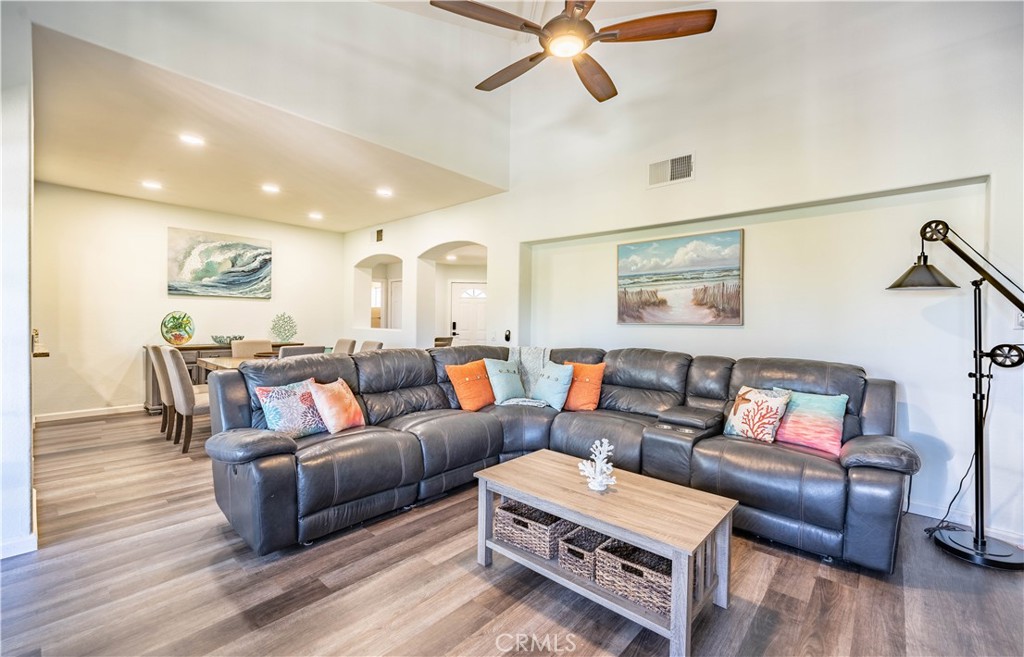 102 Vía Contento Rancho Santa Margarita, CA 92688 - Photo 7 of 40 a living room with furniture and a wooden floor