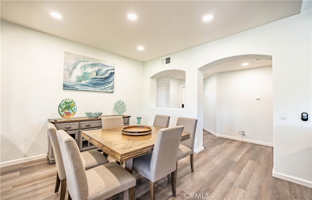 102 Vía Contento Rancho Santa Margarita, CA 92688 - Photo 9 of 40 a view of a dining room with furniture and wooden floor