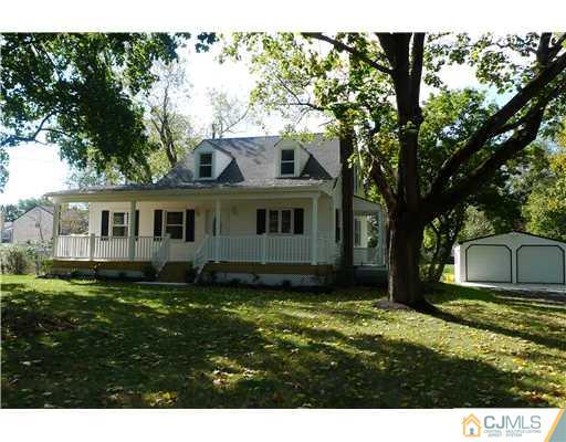541 Georges Road Dayton, NJ 08810 - Photo 1 of 24 a front view of a house with a garden