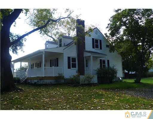 541 Georges Road Dayton, NJ 08810 - Photo 2 of 24 a front view of a house with a garden