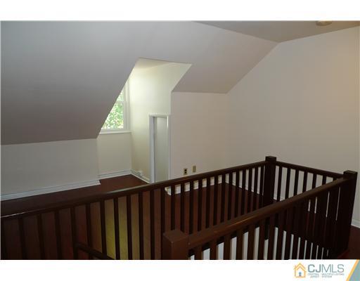 541 Georges Road Dayton, NJ 08810 - Photo 11 of 24 a view of staircase with railing and a rug