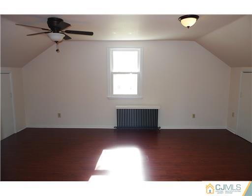 541 Georges Road Dayton, NJ 08810 - Photo 12 of 24 a view of a livingroom with a ceiling fan and window