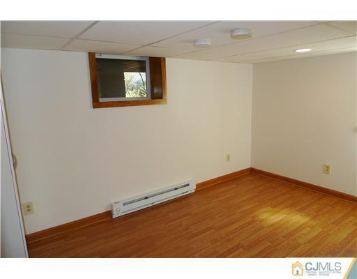541 Georges Road Dayton, NJ 08810 - Photo 17 of 24 a view of an empty room with wooden floor