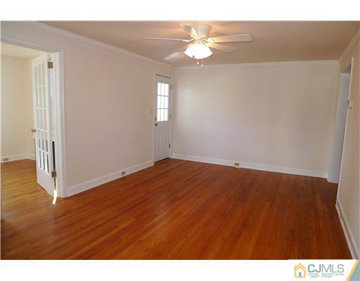 541 Georges Road Dayton, NJ 08810 - Photo 4 of 24 a view of empty room with wooden floor