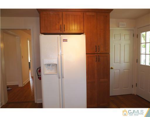 541 Georges Road Dayton, NJ 08810 - Photo 6 of 24 a bathroom with a sink and a mirror