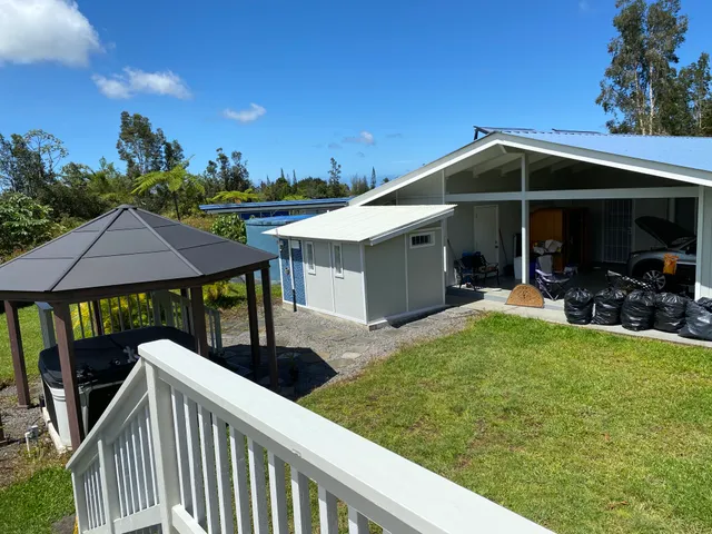 a view of a porch with furniture and yard