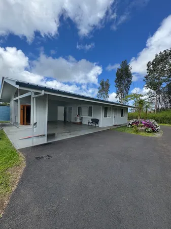 a view of a house with a street
