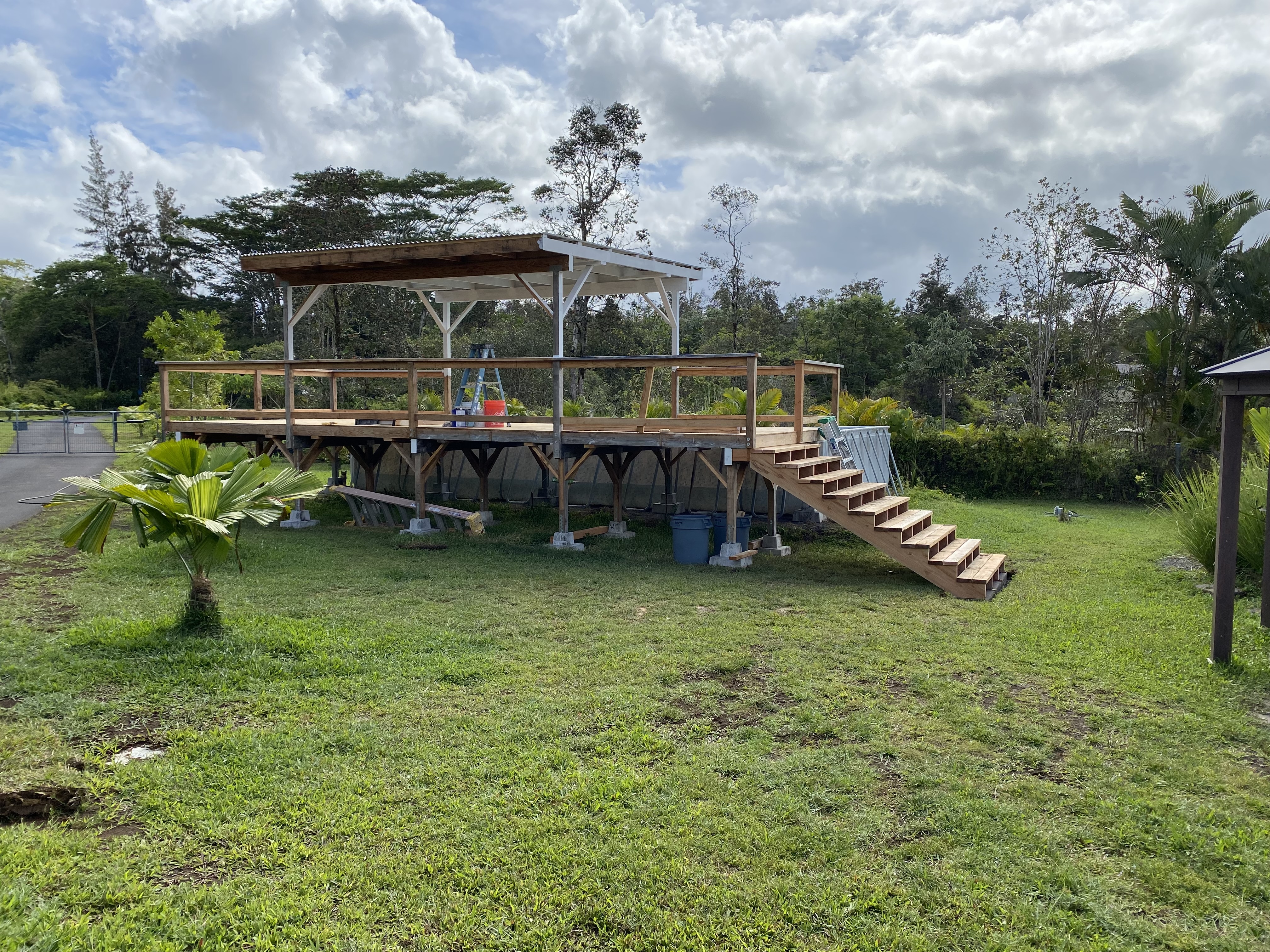 16-1321 Moho Road Keaau, HI 96749 - Photo 10 of 19 a view of a swimming pool and lounge chairs in back yard of the house
