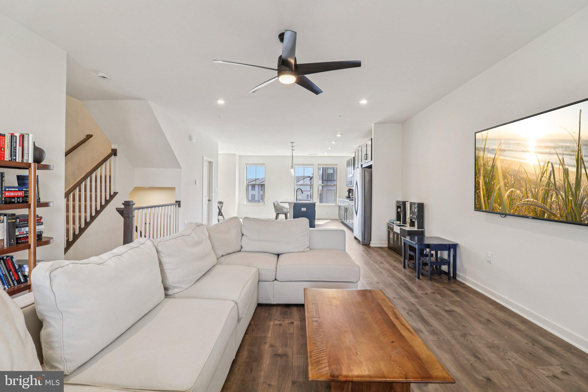 45916 Swallow Terrace Sterling, VA 20165 - Photo 15 of 41 a living room with furniture and a ceiling fan