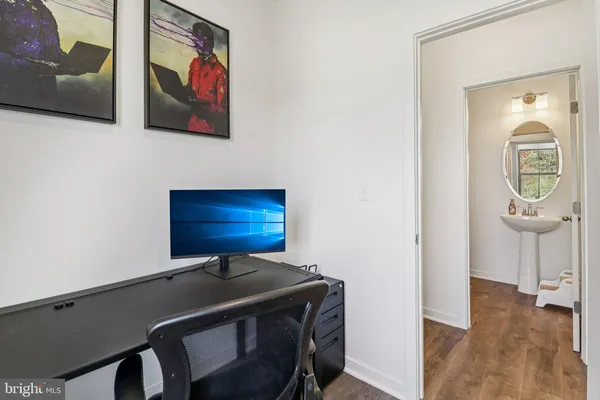a view of a workspace with furniture