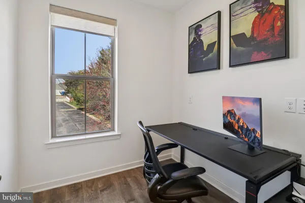 a bedroom with a bed and a ceiling fan