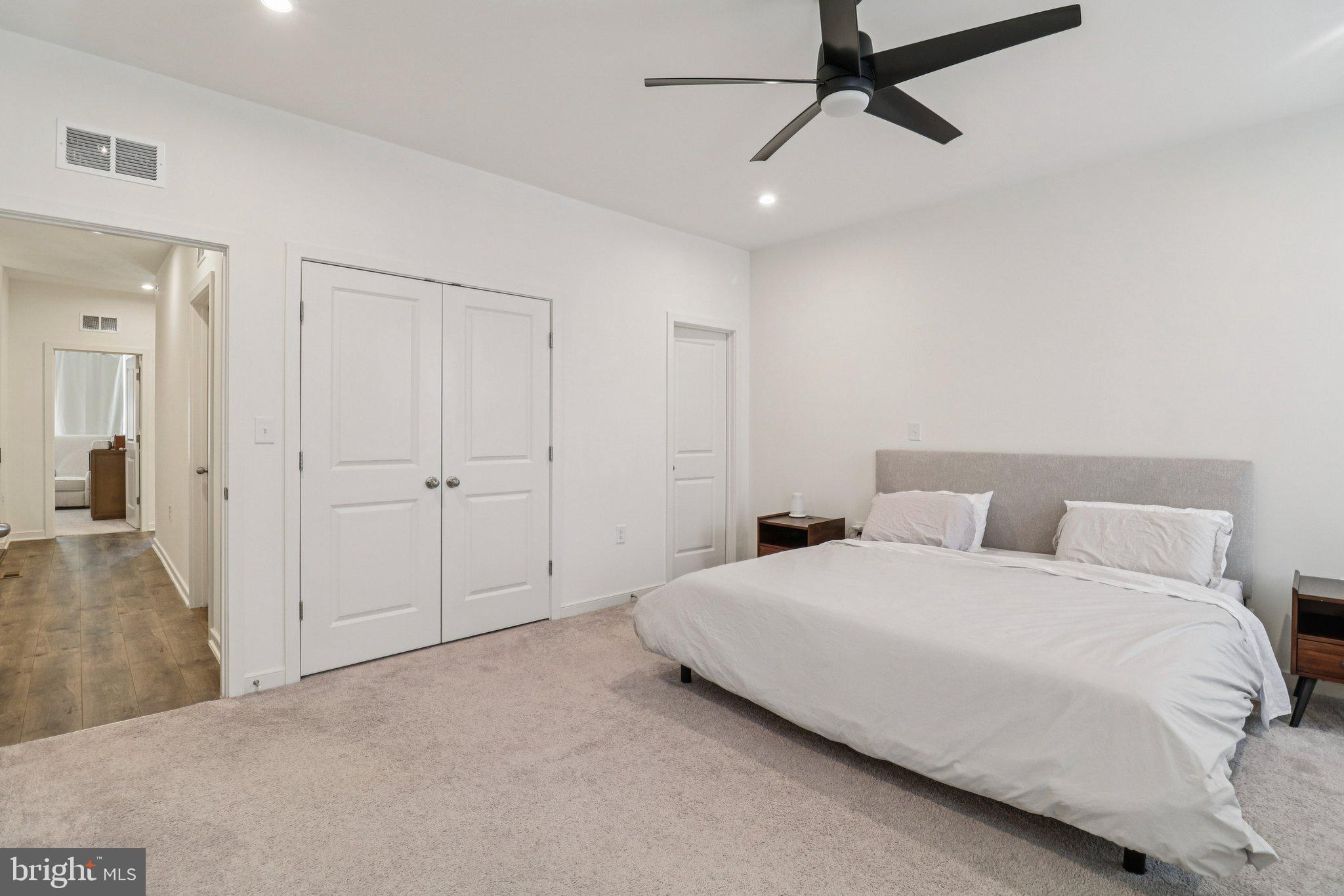45916 Swallow Terrace Sterling, VA 20165 - Photo 23 of 41 a bedroom with a bed and a chandelier
