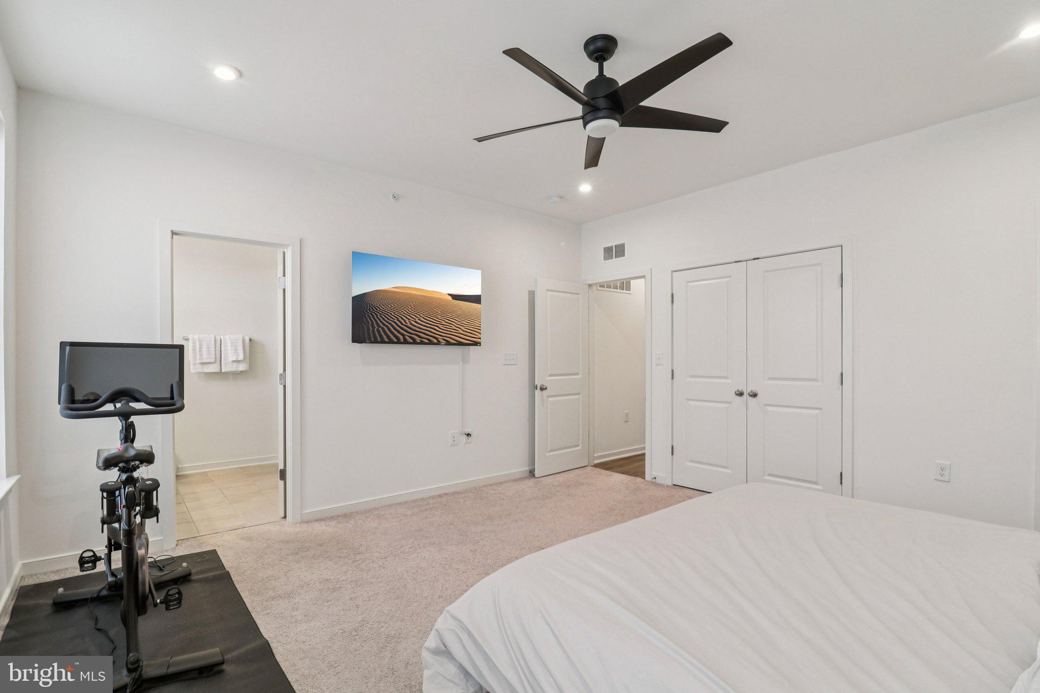 45916 Swallow Terrace Sterling, VA 20165 - Photo 24 of 41 a bedroom with a bed and a chandelier
