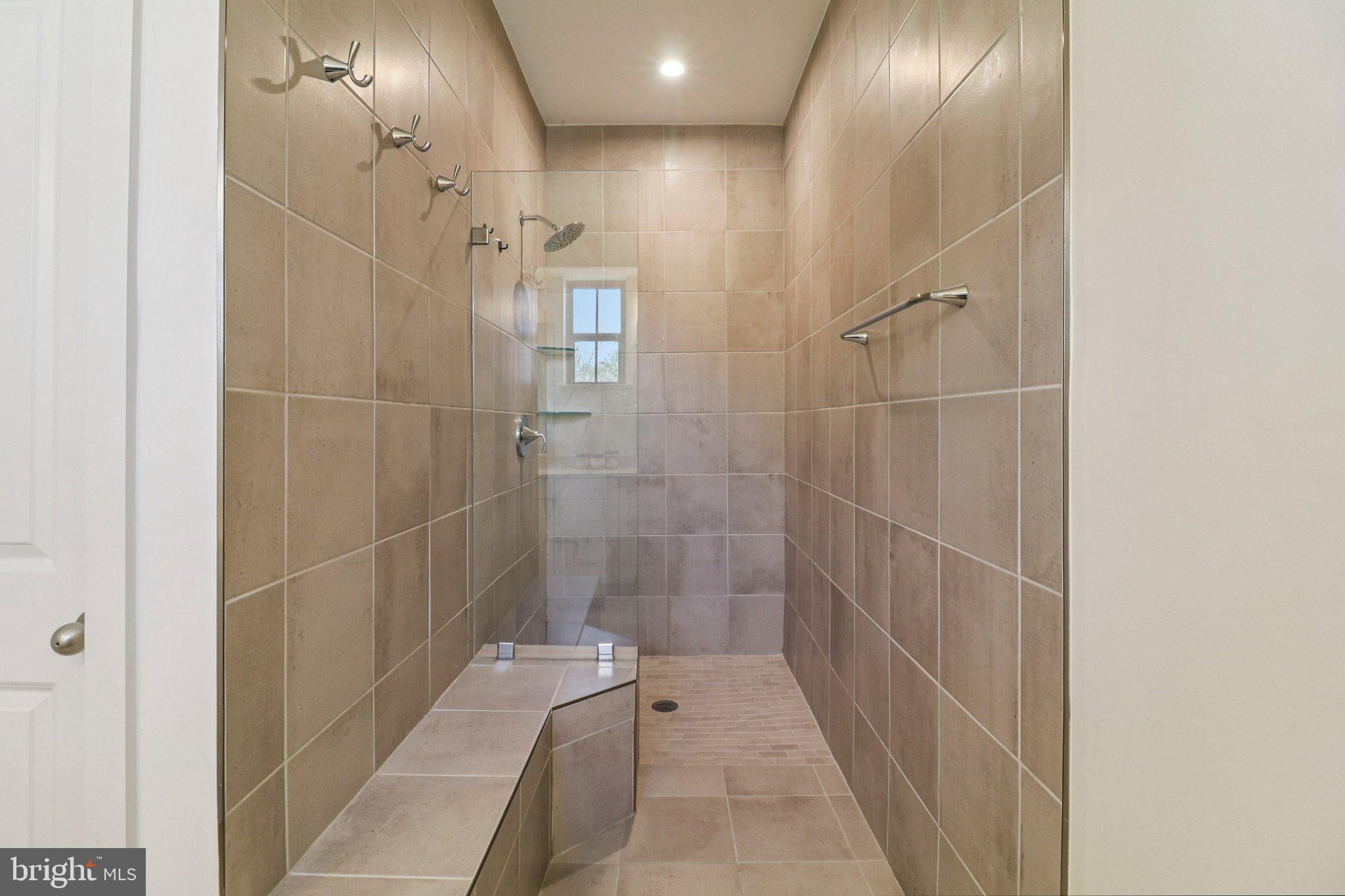 45916 Swallow Terrace Sterling, VA 20165 - Photo 25 of 41 a bathroom with a bathtub and shower