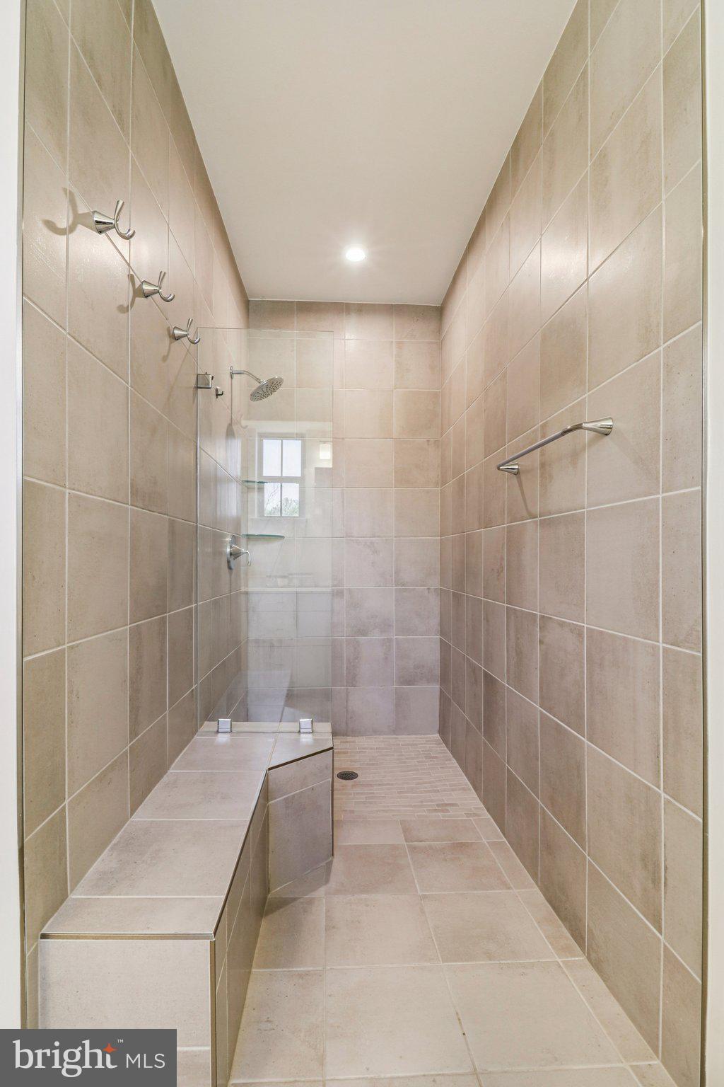 45916 Swallow Terrace Sterling, VA 20165 - Photo 26 of 41 a bathroom with a bathtub and shower