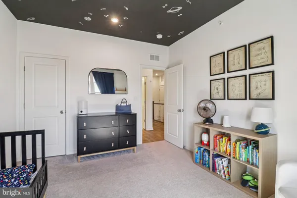 a livingroom with furniture window and a wooden floor
