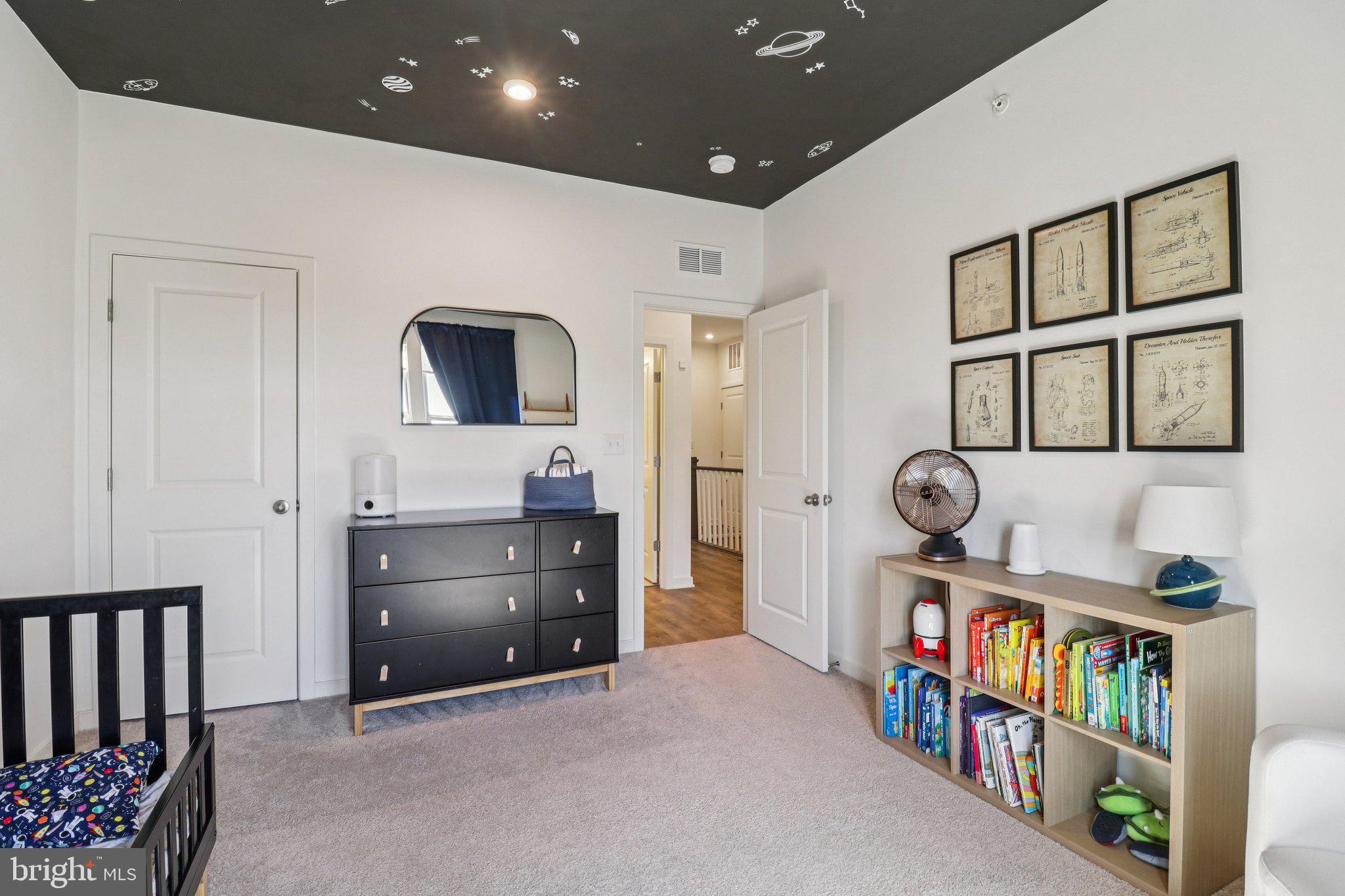 45916 Swallow Terrace Sterling, VA 20165 - Photo 34 of 41 a living room with furniture and a flat screen tv
