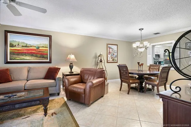 a living room with furniture a dining table and a piano